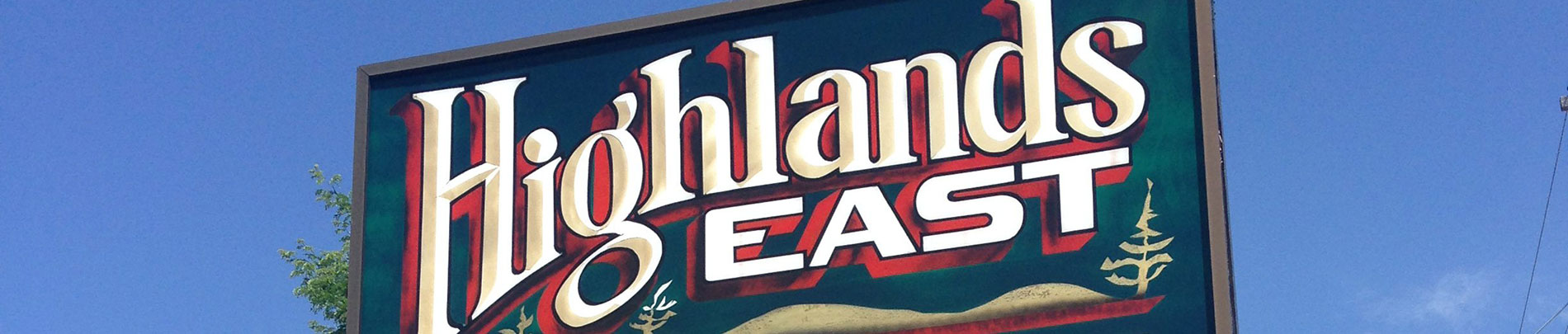 A close up of the sign in front of the municipal office that reads Highlands East.