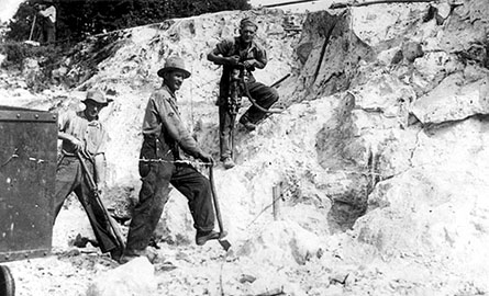 An old black and white photo of miners.